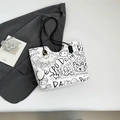 White graffiti tote bag with black shoulder straps and a white cloud plush charm - White With Pendant