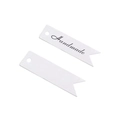 Close-up of white swallowtail gift tags with Handmade print and pre-punched holes - Handmade / White