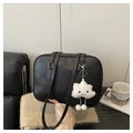 Detail of a black leather tote bag with white cloud plush pendant on a cozy sofa - Black (With Cloud Pendant)