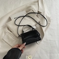 Mini black patent leather crossbody handbag with handle and glossy minimalist finish - Black