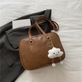 Brown leather bowling tote bag with silver hardware and a white plush cloud charm - With Pendant / Brown