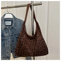 Detail shot of the large leopard print tote bag with premium brown leather strap - Leopard Coffee