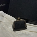 Classic black lychee pattern kiss-lock coin purse with vintage gold clasp on silk background - Black
