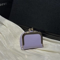 Purple mini lychee leather clasp purse with gold frame on white silk and dark background - Purple