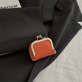 Mini orange kiss-lock coin purse with lychee texture and golden metal frame - Orange