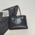 Minimalist black large capacity tote bag with smooth faux leather texture for office commute - Black