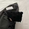 Chic black 3D rose textured clutch bag with realistic floral petal design and zipper detail - Black