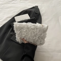 Elegant white clutch bag with 3D lace floral details and gold metal zipper finish - White