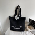 Minimalist black tote bag featuring white embroidery and large capacity for daily use - Black