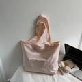 Pink canvas tote bag with heart embroidery for women in a cozy home setting - Pink