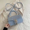 Light blue cross-body bag with snake pattern flap and gold interlocking metal logo - Blue