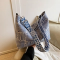 Blue and white plaid woven tote bag with a wide adjustable geometric shoulder strap - Blue