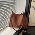 Caramel leather tote bag with minimalist shoulder design and unique knot detail - Brown