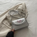Metallic silver crossbody bag with pink butterfly embroidery and long shoulder strap - Silver