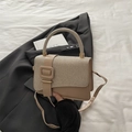 Minimalist champagne beige shoulder bag with textured fabric and square buckle detail - Khaki