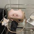 Cute khaki cat-themed handbag with ears and rabbit plush charm on a display shelf - With Pendant / Khaki