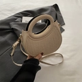 Beige woven crescent handbag with circular handle and detachable crossbody strap - Gold
