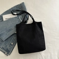 Large capacity black canvas tote bag with slim shoulder straps and matte finish - Black
