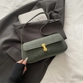 Dark green baguette shoulder bag with leopard print and gold metal buckle on a blazer - Green