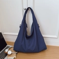 Large dark blue nylon tote bag with drawstring detail in a minimalist home setting - Dark Blue