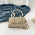 Champagne gold leather handbag with crossbody chain and decorative strap buckles - Champagne