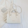 Minimalist off-white high-capacity crossbody bag with Fashion Bags text and gold hardware - White