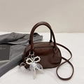 Dark brown shiny PU leather bowling bag with pearl bow charm and crossbody strap - Coffee With Pendant