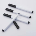 Close-up of four black ink markers with white plastic bodies and durable fiber tips - Black Markers