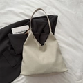 Large beige suede tote bag with beaded charm on a blazer, chic 2025 minimalist style - With Pendant / Beige