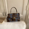 Detail of vintage plaid underarm bag with brown leather trim and metallic buckle - Blue