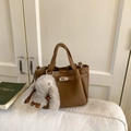 Brown litchi pattern leather bucket bag with silver turn-lock and plush bunny charm - Brown with Pendant