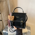 Retro black leather backpack with white stitching and plush bear charm for casual wear - With Pendant / Black