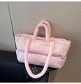 Detailed view of the light pink quilted tote bag with padded shoulder straps and large capacity - Pink