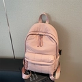 Pink quilted puffer backpack with braided pullers and printed straps for school or commuting - Pink