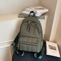 Olive green quilted backpack with padded texture and stylish letter strap - Green