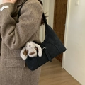 Matte black dumpling shoulder bag with a cute white plush bunny charm on long strap - Black With Pendant