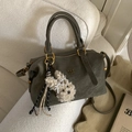 Olive green vintage handbag with gold logo and cute cream lamb plush charm detail - Green with Pendant