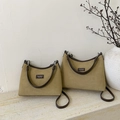 Detail view of khaki suede tote bags with contrast leather handles on stone surface - Large / Khaki