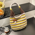 Striped knit bucket bag in grey, yellow, and brown with a 3D mushroom accent - Yellow