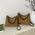Detail view of brown suede tote bags with leather trim on elegant marble surface - Large / Yellow Brown