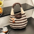 Brown and grey striped knit bucket bag with a 3D mushroom pendant and soft texture - Brown