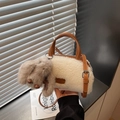 White faux fur cylinder bag with leather handles and a plush dog charm ornament - White with Pendant