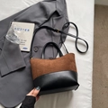 Brown and black contrast bucket bag with dual handles and gold-toned hardware - Coffee without Pendant