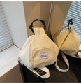 Detail of checkered cream crossbody bag with woven handle and front zipper pocket - White