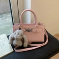 Pink lychee leather crossbody bag with silver heart buckle and gray rabbit charm - Pink with Pendant