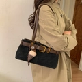 Black suede baguette bag with brown leather straps and gold buckle worn with a trench coat - Black with Pendant