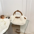 Elegant white faux fur handbag with brown leather handles and decorative buckles - White