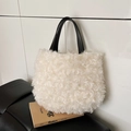 Chic cream faux shearling bucket bag with contrast black leather handle on a leather seat - Rice White (No Pendant)
