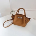 Caramel faux leather bucket bag with silver twist lock and litchi grain texture - No Pendant / Brown