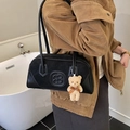 Vintage black bowling bag with BB logo and cute bear charm worn by a model - With Charm / Black